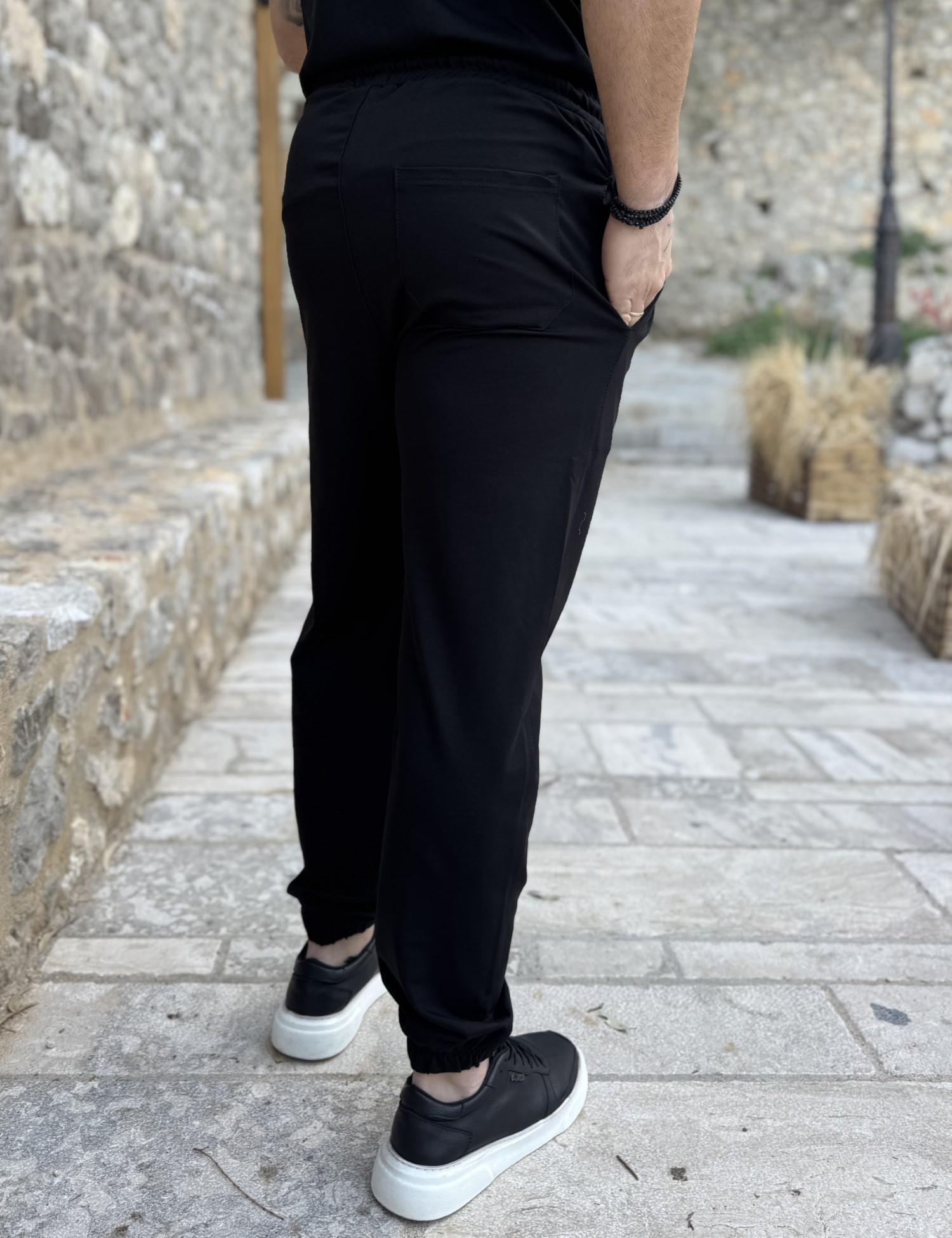 Ανδρική μαύρη φόρμα με λάστιχο και λογότυπο στο πλάι ES302M φωτογραφία